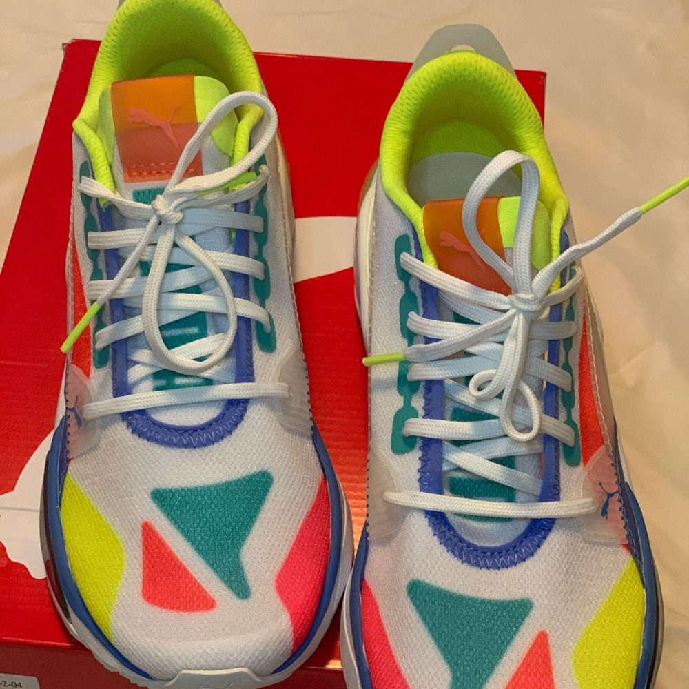 Women Puma  white and multicolored sneakers.